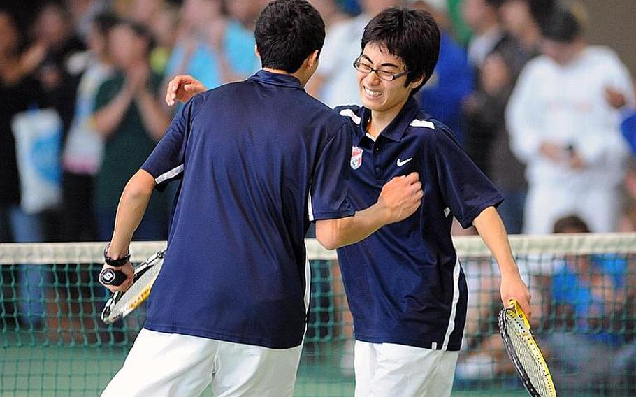 Sergio Valdes, left, and Shotaro Shobu of International School of Brussels celebrate their 0-6, 6-4, 7-6 (12-10) win over Aryan von Eicken and Forrest Kamperman of Ramstein in the boys doubles final at the DODDS-Europe tennis championships on Saturday.