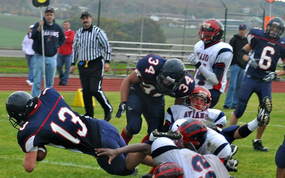Bitburg junior Kyle Edgar dives for one of his three touchdowns in the Barons' defeat of the Aviano Saints, 50-21.
