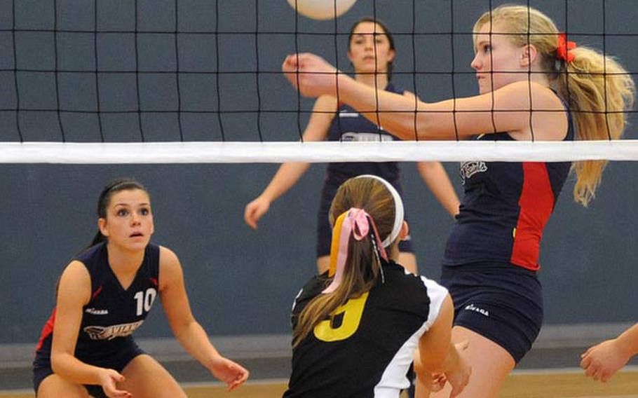 Aviano's Victoria Newbill bumbs the ball as teammate Giulia Silvi, left, and Vicenza's Natalie Lovelace watch. Vicenza beat Aviano 25-21, 25-20 in Division II action at the DODDS-Europe volleyball championships in Kaiserslautern on Thursday.