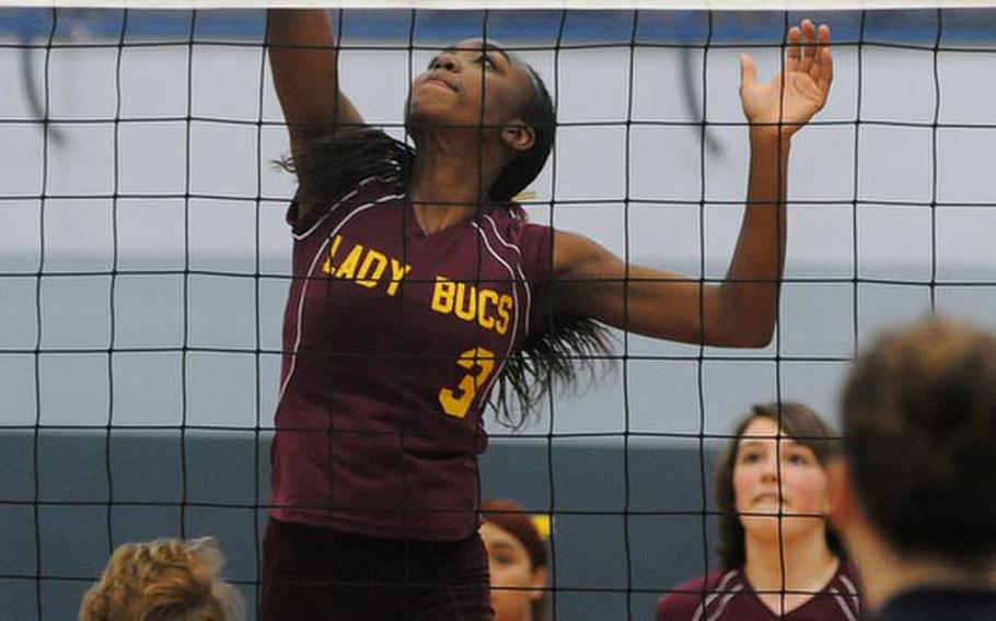 Baumholder's Dionna Marcus goes high to knock back a ball in the Lady Buccaneers' 25-18, 25-8 win over Milan.