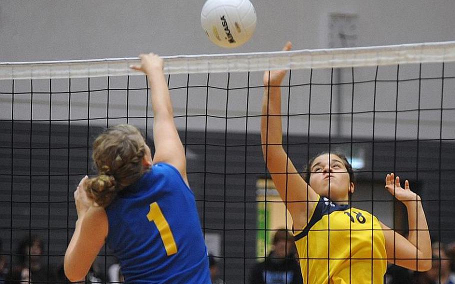 Sigonella's Rachel Vosler, left, and International School of Florence's Caterina Sodi battle at the net in a Division III semifinal at the DODDS-Europe volleyball championships in Ramstein. Florence won 25-20, 25-21, 25-17 to advance to Saturday's final against Rota.