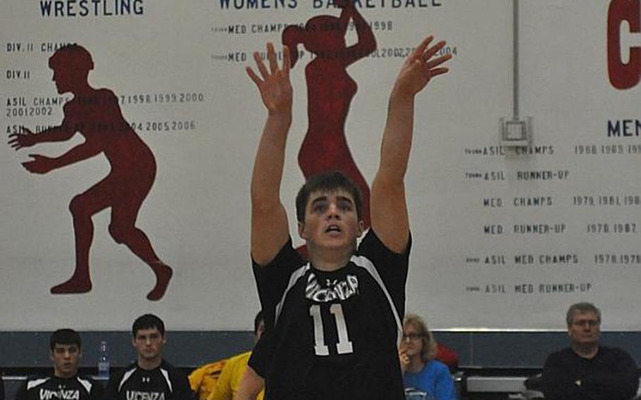 Vicenza senior Cooper Armstrong sets the ball toward the net in the finals of the Mediterranean boys volleyball championships Saturday at Aviano Air Base, Italy. The Cougars fell to Naples 25-22, 25-15, 25-23 for the title.