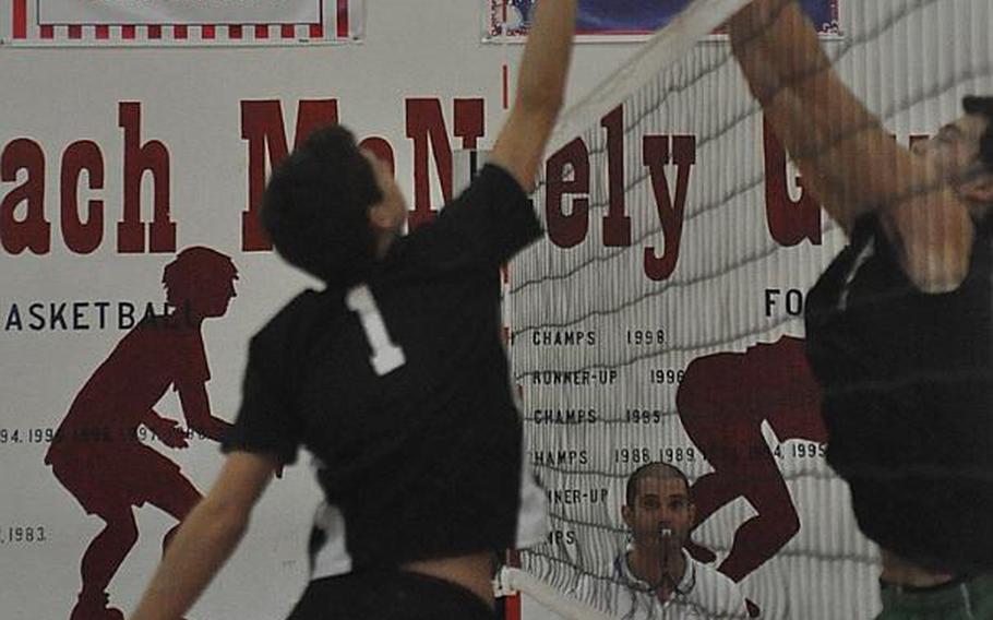 Vicenza senior Michael De Oliveira  tries to tap the ball past the Naples defense Saturday in the finals of the Mediterranean boys volleyball championships at Aviano Air Base, Italy. Naples won 25-22, 25-15, 25-23.