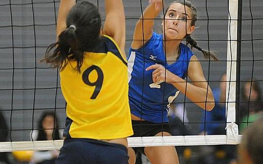 Rota's Aspen Luna slams a ball past Florences Silvia Fasciano in the Division III final at the DODDS-Europe volleyball finals in Ramstein on Saturday. Rota defended its title with a 25-19, 25-13, 25-15 victory, and Luna was named the division's MVP for the tourney.