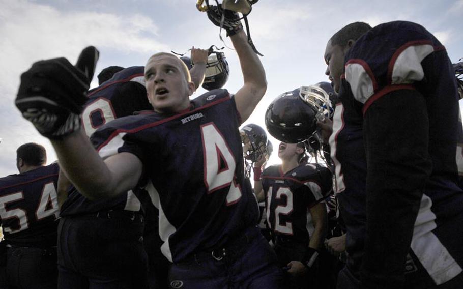 Bitburg players celebrate after winning their third consecutive Division II championship against Ansbach, 39-18.