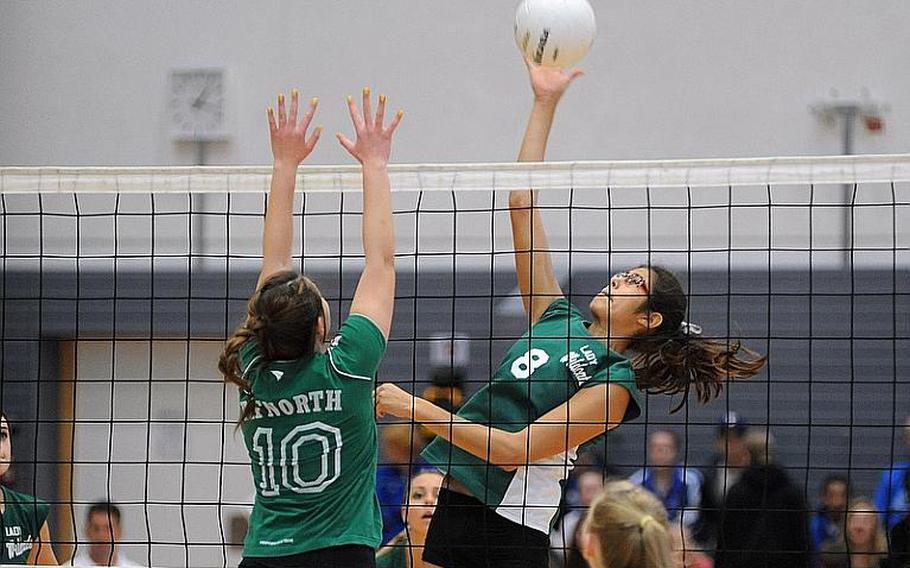 Isabel Krause of Naples, right, gets the ball over the defense of AFNORTH's Selin Gencer.  Naples beat AFNORTH 25-14, 25-12, 25-13 for the Division II title at the DODDS-Europe volleyball finals in Ramstein on Saturday.