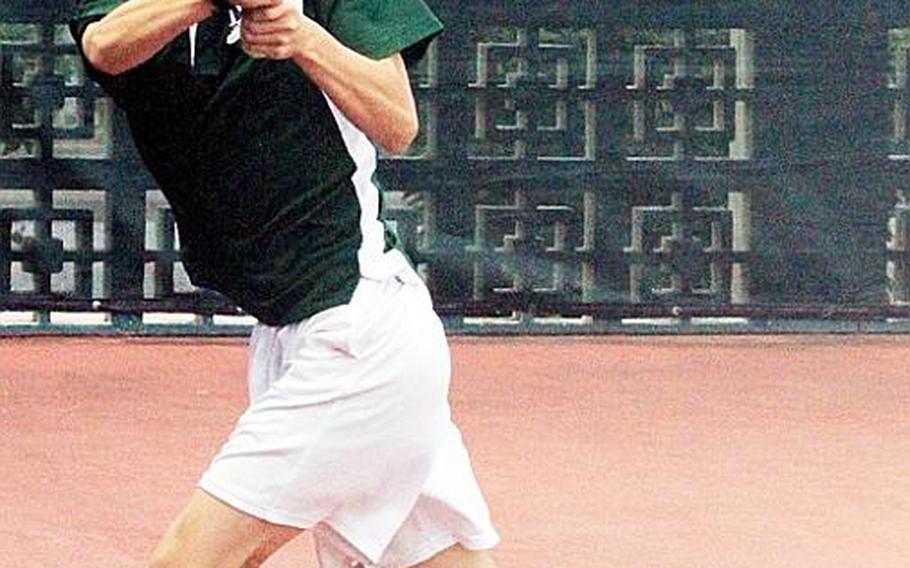 Matthew Hwang of Daegu American slaps a cross-court return to Jay Han of Seoul American during Tuesday's round-of-16 match in the 2011 Far East High School Tennis Tournament at Risner Tennis Complex, Kadena Air Base, Okinawa. Han won 8-1. No matches were completed on Wednesday due to day-long rain. Twenty-one matches remain to be played in the main draw; more rain is in the forecast for the morning Thursday, the tournament's designated rainout day.