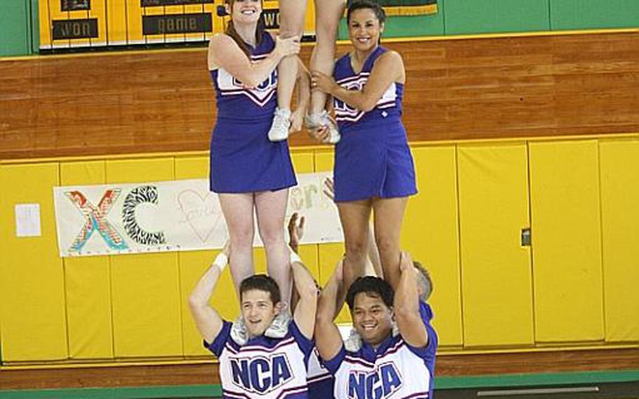 Cheerleaders from across DODDS Pacific gathered for five days of camps and competition at the 2011 Far East Cheerleading Competition at Misawa Air Base, Japan this week. Here, students practice proper lift and stunt techniques.
