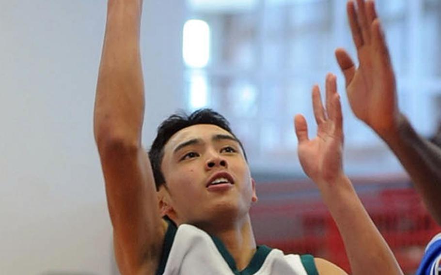 Jun Jun Galardo of Naples shoots over the Ansbach defense in Division II action at the DODDS Europe basketball championships in February. Galardo will be returning for the Wildcats when the DODDS-Europe 2011-12 season gets under way this weekend.