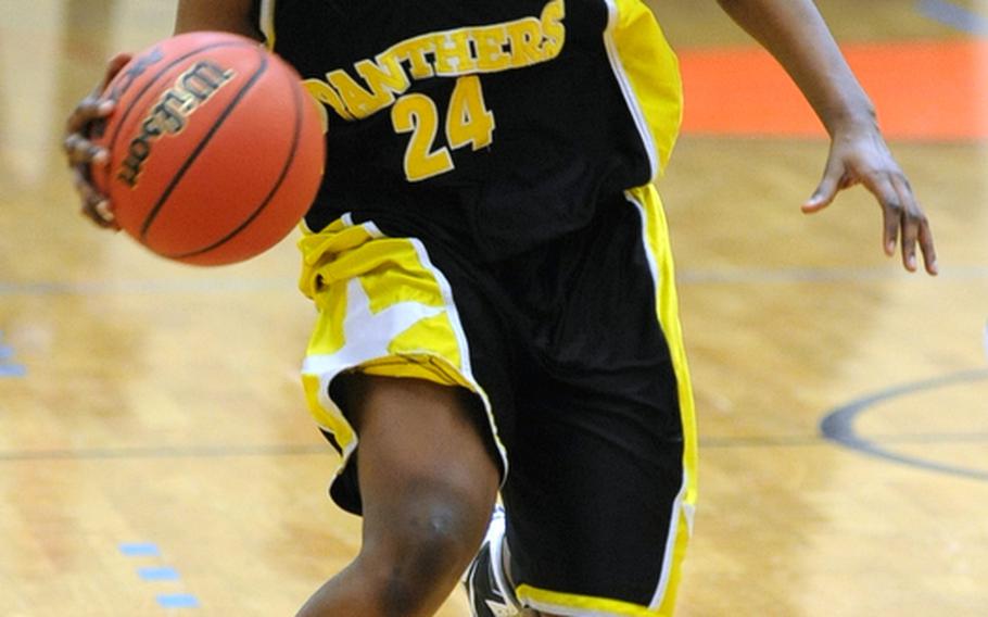 Patch's Janelle Loney drives the ball up court in the Division I final against Vilseck in February. Loney and her fellow Lady Panthers will be out to defend their Division I title when DODDS-Europe 2011-12 season gets underway this weekend.
