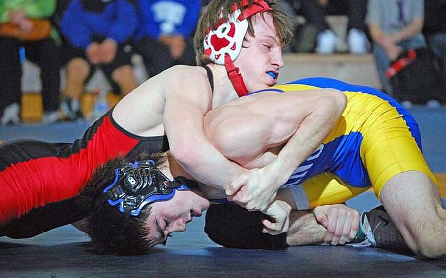 Nile C. Kinnick Red Devils senior Marcus Boehler, top, will wrestle at 135 pounds this season and is trying to become just the third to win four Far East Tournament titles.