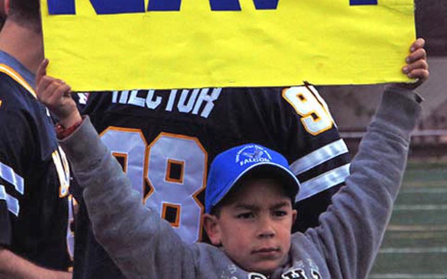 A young fan displays his allegiance during the Army-Navy game Saturday at Seoul American High School.  Army, led by three touchdown passes by quarterback Jeremy Finney, won the game 30-0.