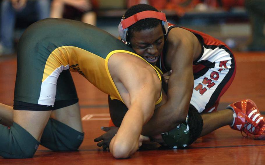 Kaiserslautern's Khadif Williams, a senior, successfully handled an offensive attack on Alconbury freshman Dana Soloman, during a season-opening wrestling match between five DODDS-Europe schools Saturday at RAF Lakenheath, England. Williams won the match by a score of 14-6.