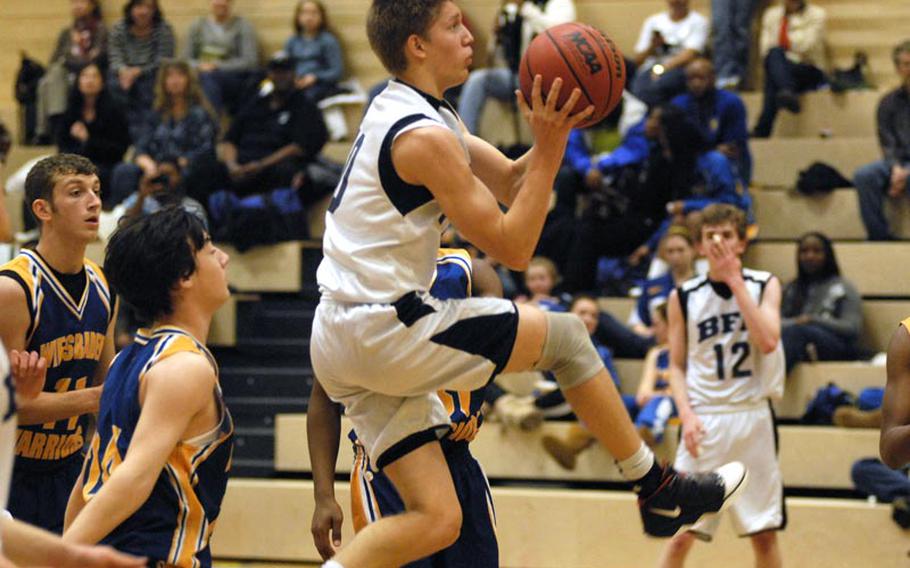 Black Forest Academy senior Josiah Kelley makes two of his 20 points on the afternoon, as the Falcons upset the Wiesbaden Warriors.