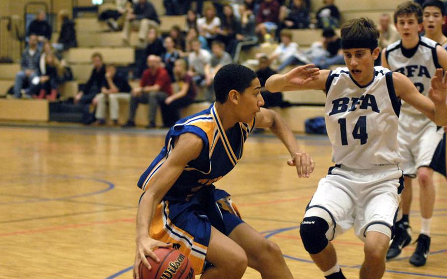 Wiesbaden sophomore Kelsey Thomas tries to outmaneuver Black Forest Academy senior Anthony Purpero during a Saturday afternoon matchup, which saw the Falcons pull off the upset.