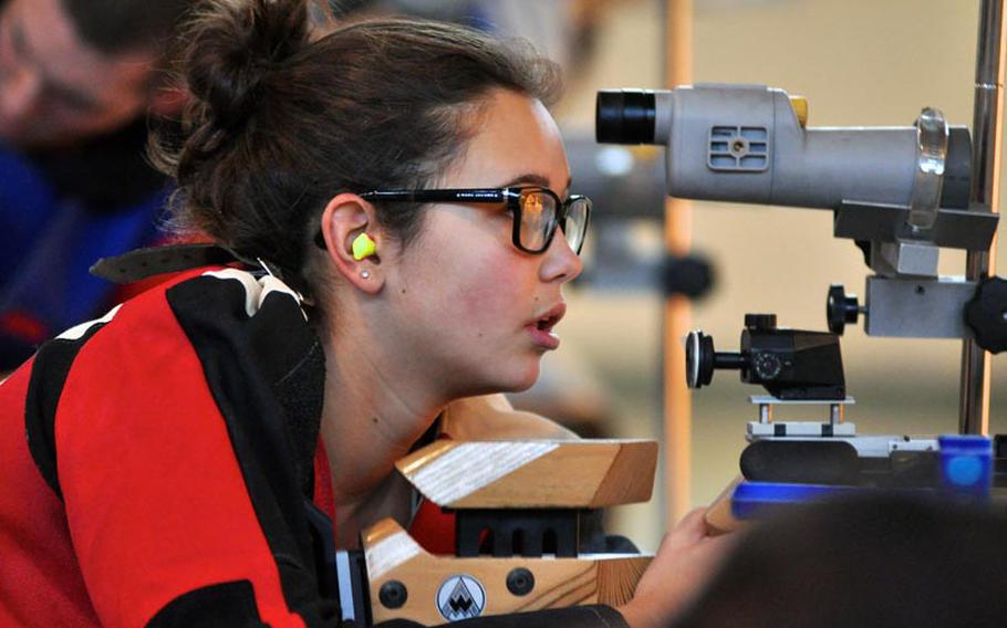 Madeline Hershberger checks her targets during the first rifle team meet of the season Saturday at Patch High School. Hershberger tied with Jennifer Johnson for highest individual score at 274. Patch won the event with a score of 1,350.