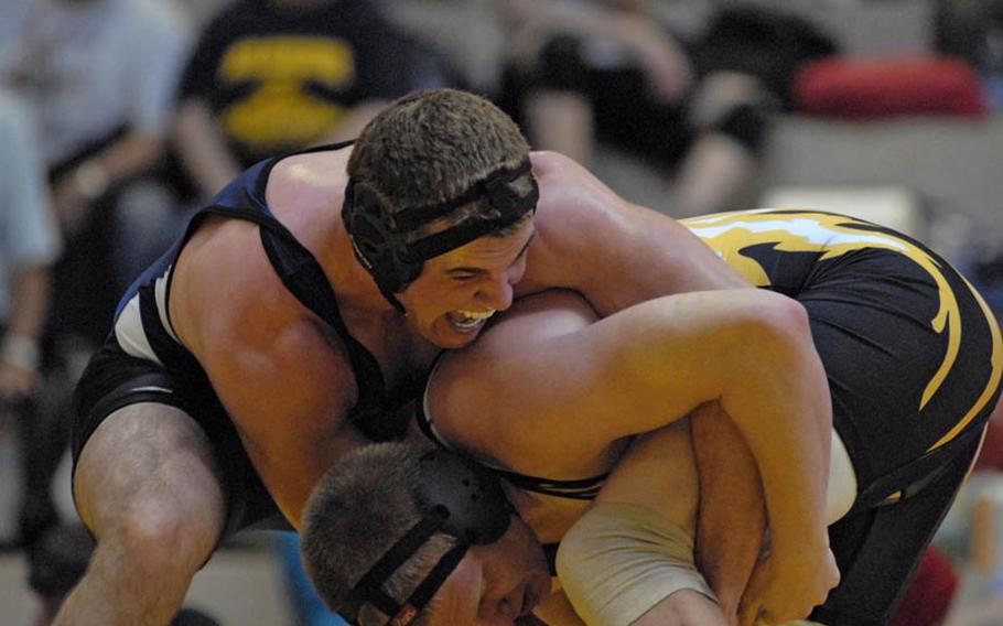 Bitburg junior Bryson Randall gets aggressive during his 182-pound weight class match against Patch senior JC Rapp during a wrestling tournament Saturday in Wiesbaden.