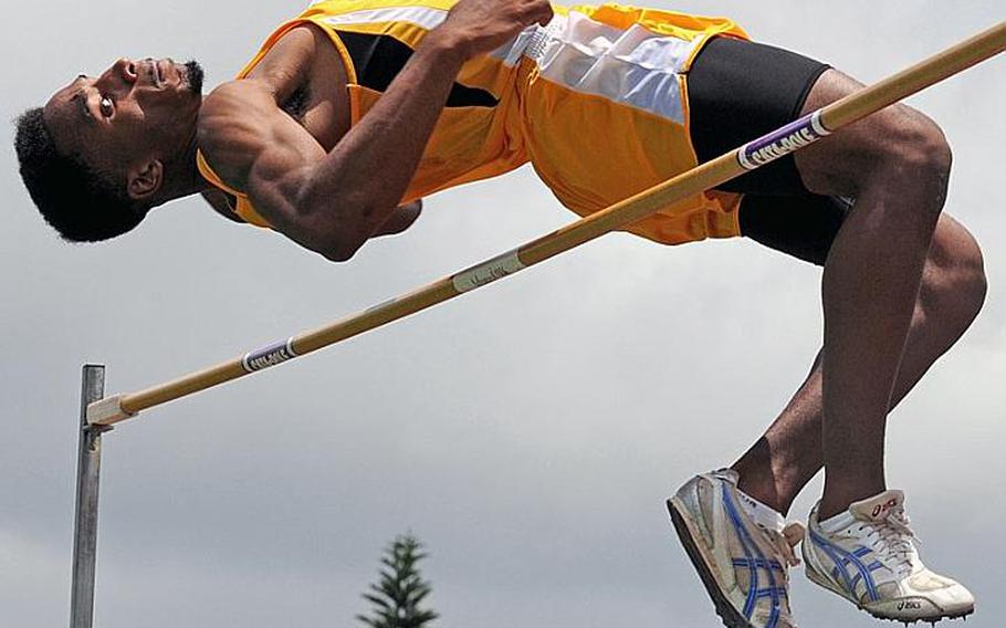 Kadena senior Lotty Smith clears the bar at 2.0066 meters, or a Pacific-record 6 feet, 7 inches, in the high jump finals during the 2011 Far East High School Track and Field Meet at Kubasaki High School, Okinawa. Smith beat his own Pacific record of 1.98 meters and his Far East meet record of 1.92 as Kadena swept the boys, girls and combined teams titles.