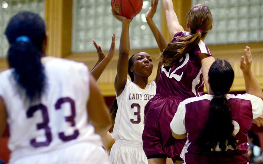 Baumholder's Dionna Marcus takes the ball into a crowd of AFNORTH players in Friday's 51-19 loss to AFNORTH.