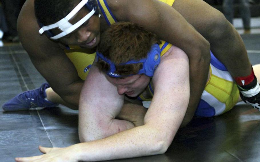 St. Mary's heavyweight Chidi Agbo gets the upper hand on Yokota's Jesse Hogan during Saturday's Zama American High School Invitational Dual-Meet Wrestling Tournament at Zama American High School, Japan. Agbo, the reigning Far East gold medalist, won by pin in 3 minutes, 50 seconds and St. Mary's beat Yokota 35-25.