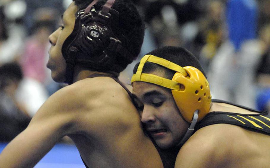 Patch senior Thomas Trevino takes down Baumholder freshman Adrian Oviedo during a 145-pound matchup at Ramstein High School on Saturday.  Ramstein hosted a seven-team wrestling tournament featuring many of DODDS-Europe brightest wrestling stars.