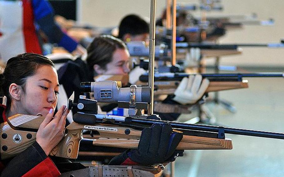 Jennifer Johnson adjusts her rifle during one of the first rifle team meets at Patch High School Dec. 3, 2011. Female marksmen have won the last six European individual crowns and placed nine in the top 10 in last year's European championships.