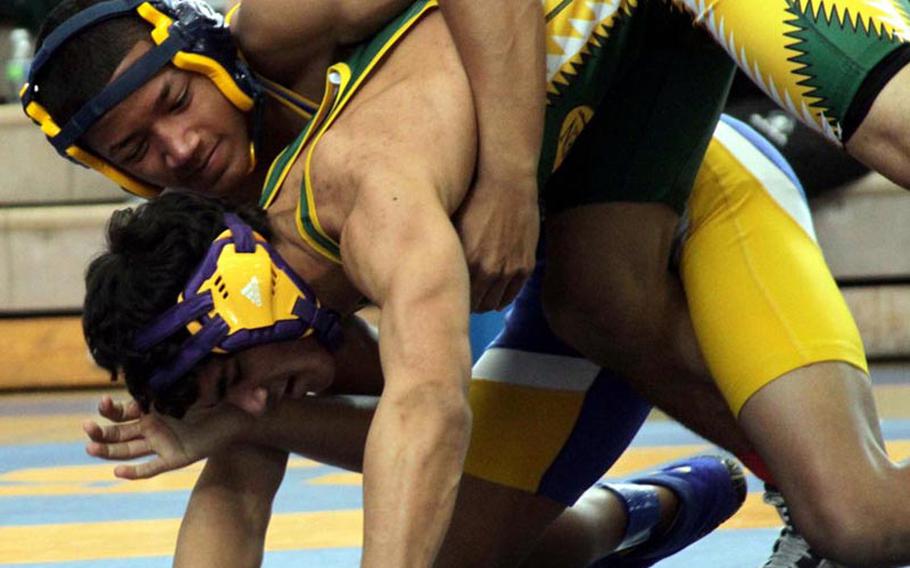 135-pounder Trenton Traylor of Yokota gains the advantage on James Bowman of Robert D. Edgren during Saturday's title bout in the DODDS Japan Wrestling Tournament at Yokota High School. Traylor won by pin and Yokota won the team title with 61 points to 44 for Kinnick.