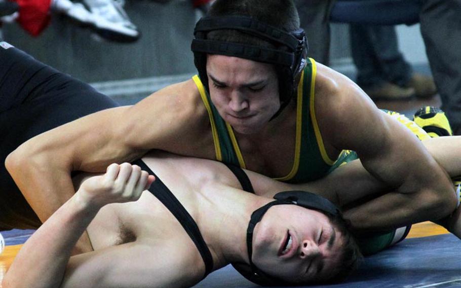 129-pounder Cody Scherrer of Robert D. Edgren gains the upper hand on Jacob Scott of Zama American during Saturday's gold-medal bout in the DODDS Japan Wrestling Tournament at Yokota Air Base. Vinson won by decision. Scherrer won by pin. Edgren took third place with 37 points to 29 for fourth-place Zama.