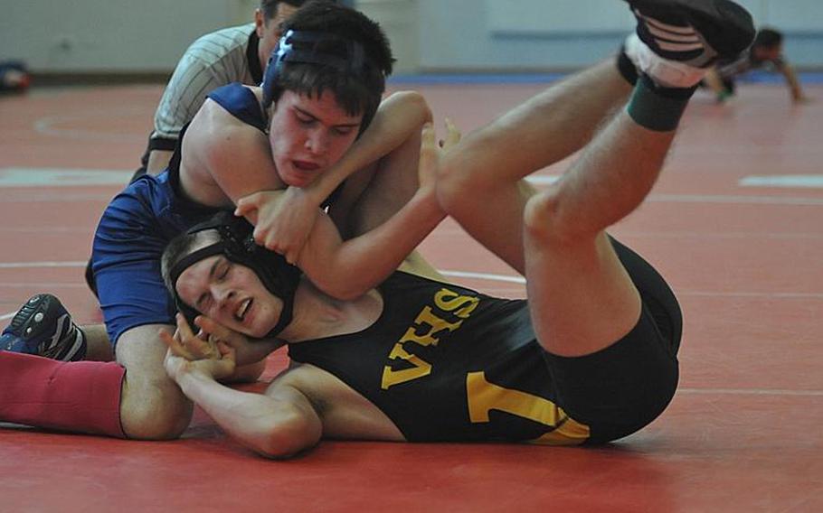 Black Forest Academy's Josh Wenger controls Vicenza's Joshua Pardew in a 138-pound match Saturday at Aviano Air Base, Italy.