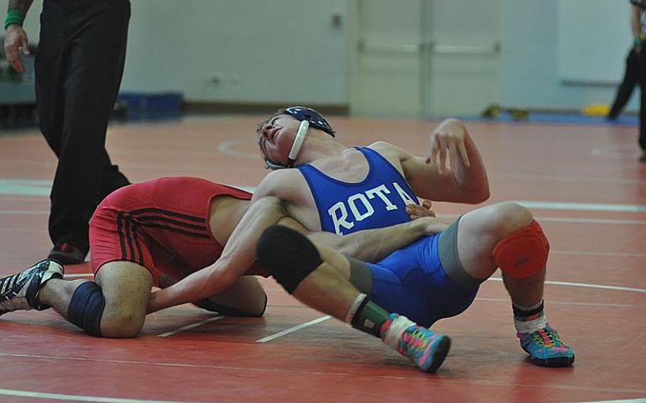 Rota's Keaton Regener tries for a third-period escape to tie his match with Aviano's Nik Weiser Saturday. But he couldn't get free and Weiser emerged with a 1-0 victory, handing Regener his first loss of the season.