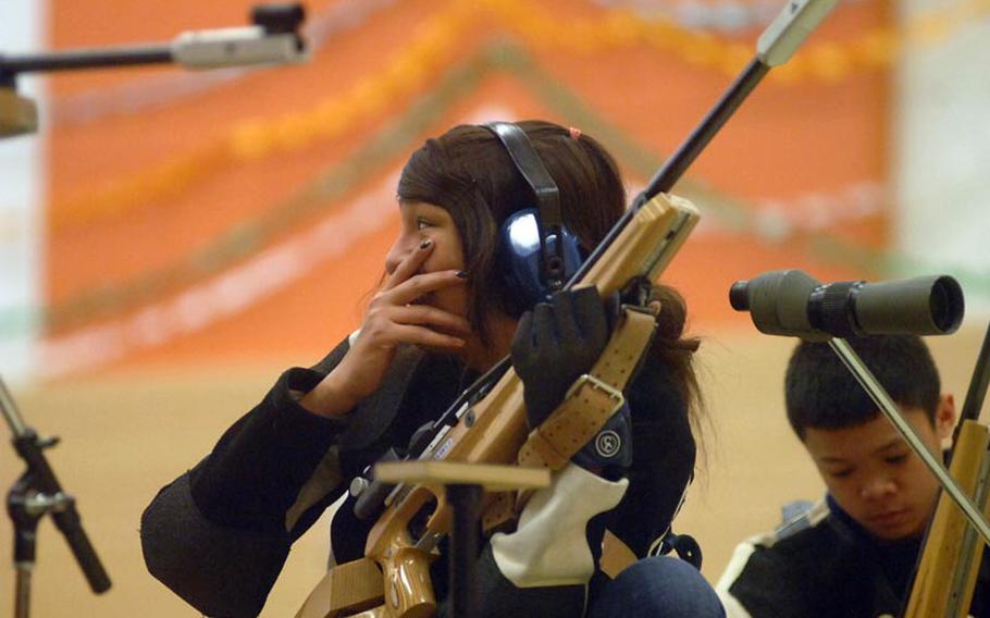 Joanna Oviedo, 15, of Baumholder High School, reacts to one of her shots during Saturday's DODDS-Europe marksmanship finals in Vilseck. Patch won its third title in four years.