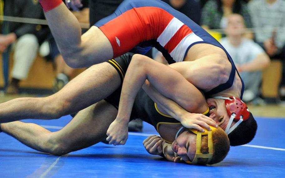 Lakenheath's Adam Carroll, top, beat Patch's Thomas Trevino for the 145-pound  title at the DODDS-Europe wrestling championships in Wiesbaden, Saturday.