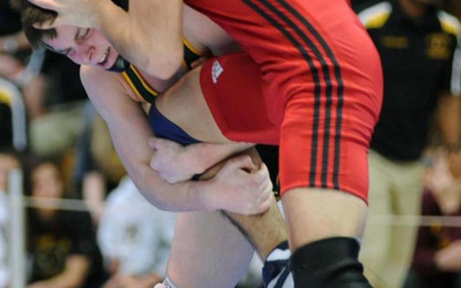 SHAPE's Matt Lengyel, left, defeated Aviano's Nikolas Weiser for the 132-pound title at the DODDS-Europe wrestling championships in Wiesbaden, Saturday.