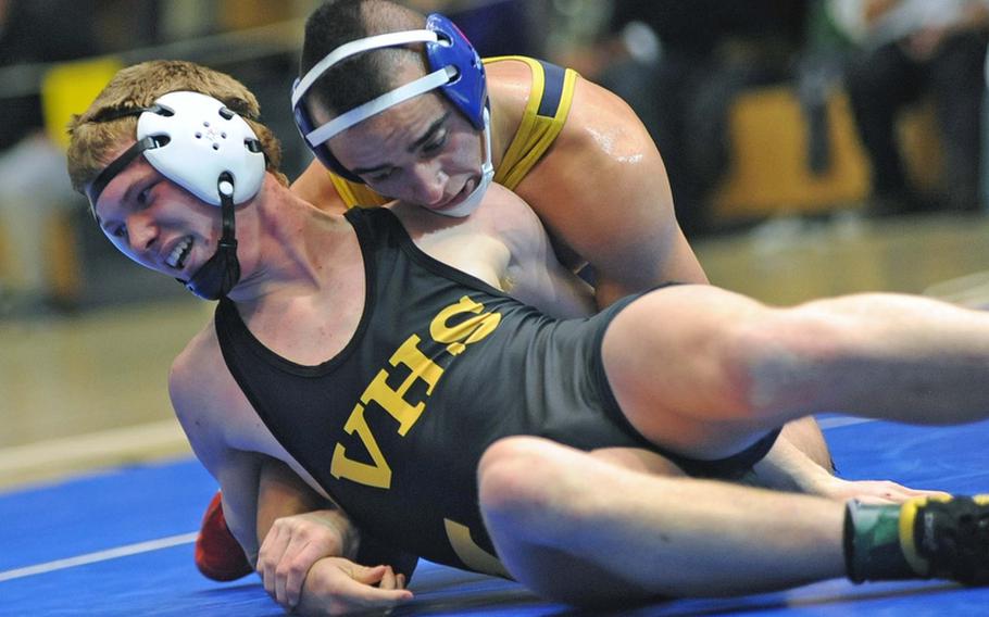 In the 160-pound title match at the DODDS-Europe wrestling championships in Wiesbaden, Saturday, Heidelberg's Jimmie McBride, right, beat Aaron Hogg of Vicenza.