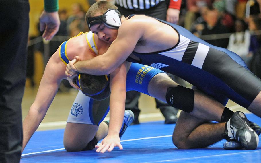Bitburg's Austin Schmidt, right defeated Wiesbaden's William Heiges for the 220-pound title at the DODDS-Europe wrestling championships in Wiesbaden, Saturday.