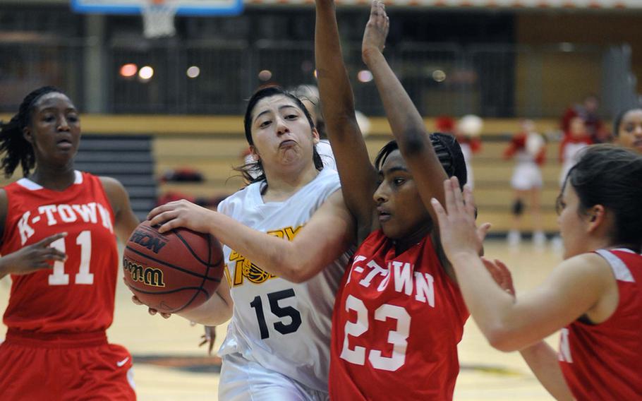 Heidelberg&#39;s Rebecca Luna cna&#39;t get past Kaiserslautern&#39;s Amber Perryman, but she and her fellow Lady Lions got past the Lady Raiders 36-28 to advance to Saturday&#39;s Division I title game at the DODDS-Europe basketball championships.