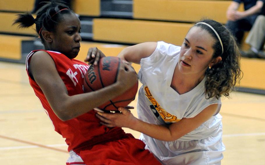 Kaiserslautern's Breona Drew, left, and Heidelberg's Kylee Miller fight for a ball in a Division I semifinal at the DODDS-Europe basketball championships. Heidelberg advanced to Saturday's final with a 36-28 win.