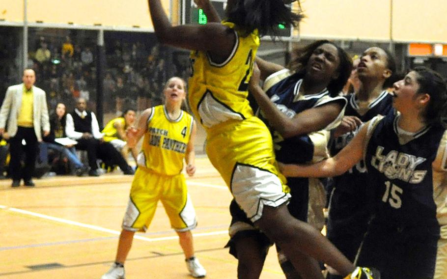 Janelle Loney leaps for the basket during a regular season game against Heidelberg. Loney has been selected as the Stars and Stripes girls basketball player of the year for the second consecutive year.