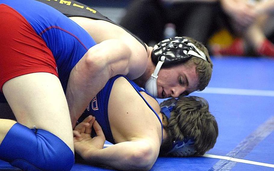 Patch's Calen Fields tries to prevent Ramstein's Josh McCarthy from getting up during a 170-pound wrestling match at Ramstein High School in January. Fields has been selected Stars and Stripes wrestler of the year.