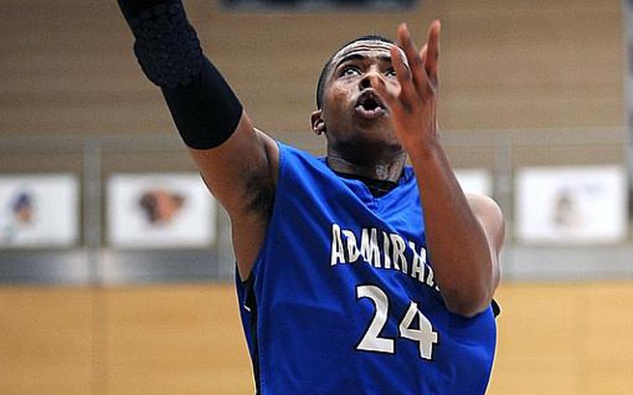 Rota's Tre'von Owens gets past Zach Ford of Lajes for a basket at the 2012 DODDS-Europe basketball championships. Owens has been selected as the Stars and Stripes boys basketball player of the year for the second consecutive year.