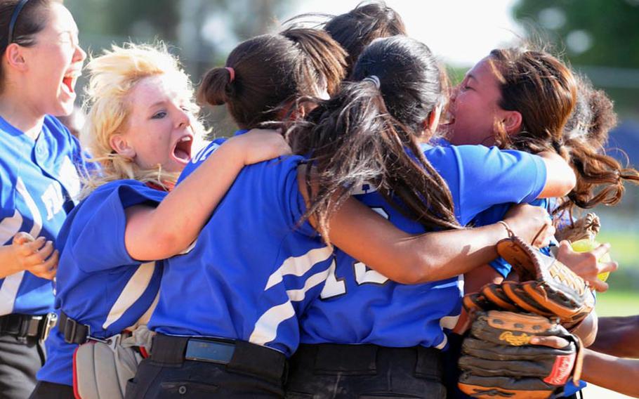 Seoul American players celebrate their 14-10, eight-inning Far East High School Girls Softball Tournament title-clinching victory over defending champion and host Kadena Kadena's new coach, Kelli Wilson, says such a thing will not happen again and that her Panthers are primed to make a run at their second Far East title in three years.