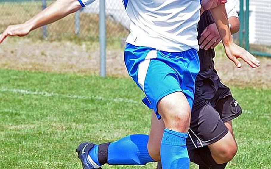 Marymount's Brando Rotelli shields the ball from a Mannheim player at last year's DODDS-Europe soccer championships. Rotelli is returning for the Lions as they try to defend their Division II title when their 2012 soccer season gets under way this weekend with a game at Aviano.