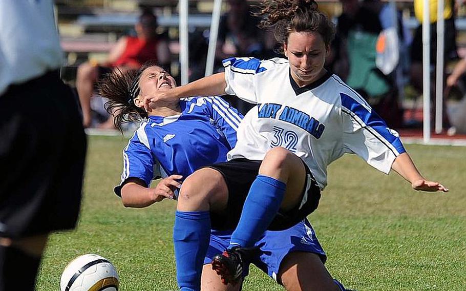 Brussels' Alexandra McVicker, left, and Rota's Thais Gartland-Bonet collide in a hard-fought Division III girls soccer final last season,won by Rota 1-0. Both players will be returning for their teams as the DODDS-Europe soccer season gets under way this weekend.