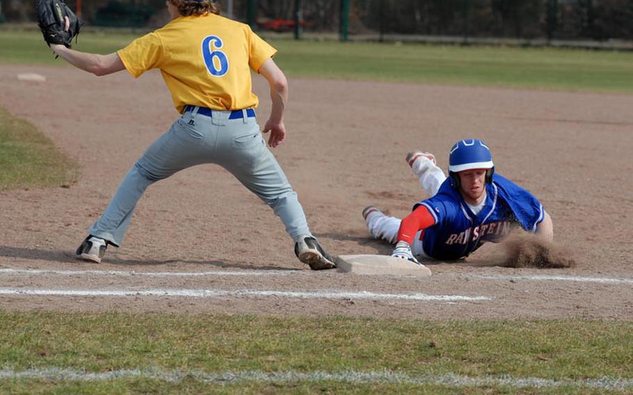 Ramstein junior Justin Pendergrass slides back to first base ahead of the tag from Wiesbaden senior John Spiszer Saturday at Ramstein Air Base. The Royals dominated a pair of games against Wiesbaden to open up their season 2-0.