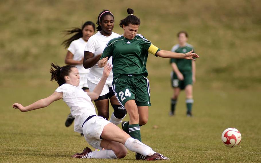 Baumholder's Makenzie Ehrhardt hustles on defense to knock the ball away from SHAPE's Melyssa Gomez in Saturday's game in Baumholder, Germany. SHAPE won the game 8-1.