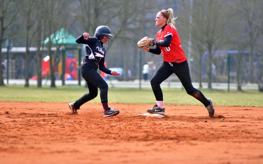 Ashely Dowdy of Schweinfurt steps on second base as Deepika Singh of Vilseck tries to make her way back to the bag Saturday in a season opening doubleheader in Vilseck, Germany. Singh was called safe on the play after no tag was made. Vilseck captured its first two wins of the season 8-3 and 23-1.