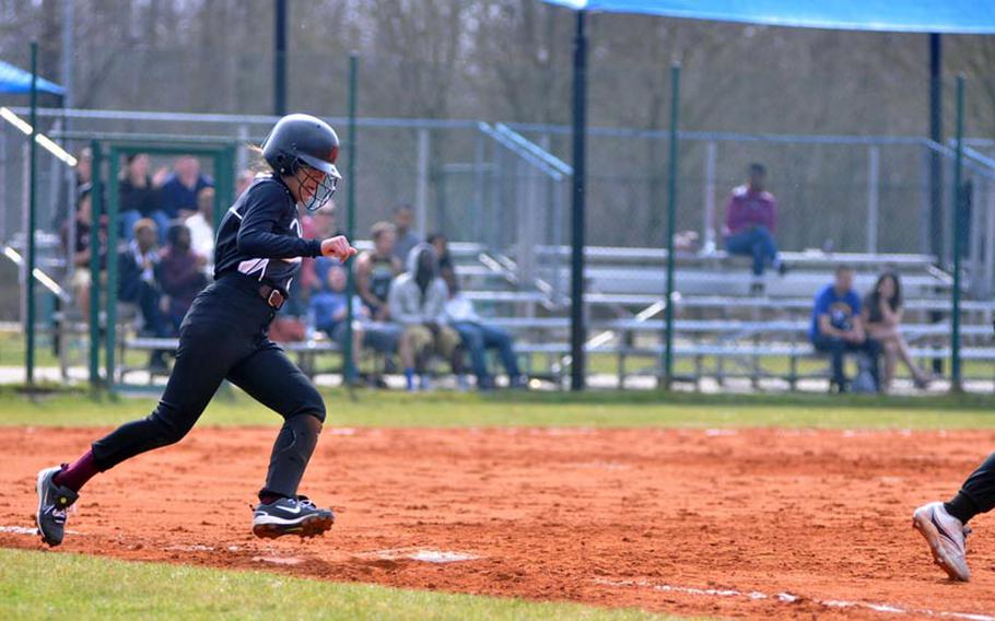 Deepika Singh of Vilseck rounds first base Saturday in a season-opening doubleheader against the visiting Lady Razorbacks of Schweinfurt in Vilseck, Germany. Vilseck captured its first two wins of the season 8-3 and 23-1.