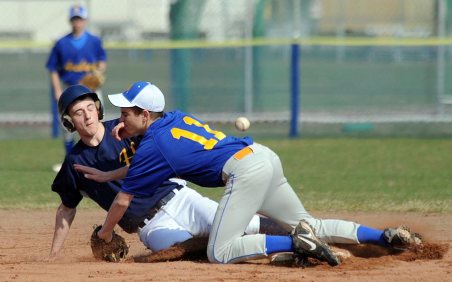 Heidelberg's Sam Nevinger slides safely back into second after being caught off base, as the ball gets away from Ansbach's Jake Voorhees. Heidelberg swept a doubleheader from visiting Ansbach, Saturday, winning 13-3, 18-5.