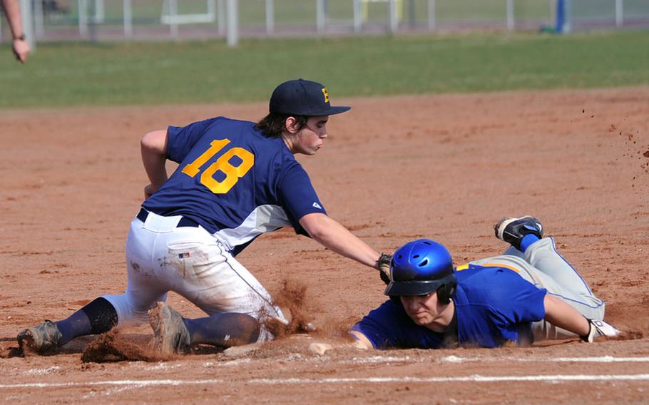 Ansbach's T.J. Propp beats the tag by Heidelberg's Joseph Patrick after being caught off first base. Heidelberg swept a home doubleheader 13-3 and 18-5.