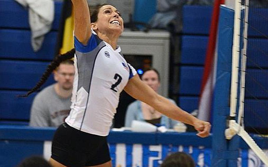 Ana-Maria Ortega from the U.S. Air Forces in Europe volleyball team spikes the ball during the championship match against a team from Germany&#39;s air force, Wednesday, at RAF Lakenheath, England. The women&#39;s team took first place and the USAFE men&#39;s team finished third in NATO&#39;s Allied Air Command volleyball championship tournament.